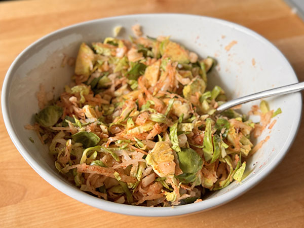Potato, Brussels sprouts, onions and spices mixture for breakfast hash.