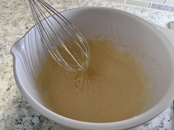 Ready-to-use no-milk pancake batter in a mixing bowl.