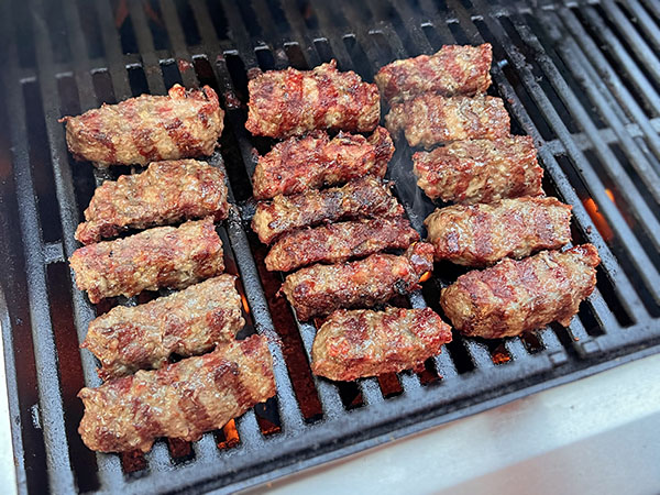 Skinless Cevapi Sausages on a grill.