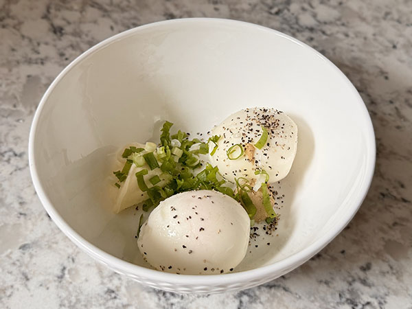 Egg salad ingredients in a bowl.