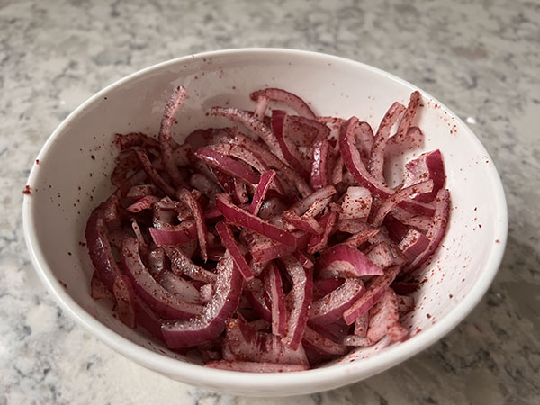 Red onion slices marinated in the mixture of lemon juice and sumac.