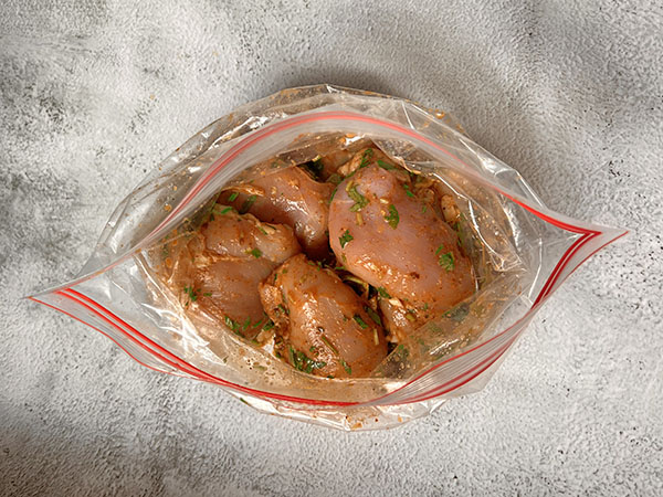 Chicken thighs with Mexican chicken marinade in a ziploc bag.